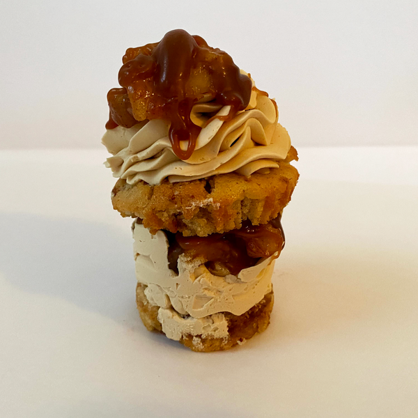 Caramel Apple stacked cupcake: Apple spiced cupcake split and filled with apple pie filling and caramel italian meringue buttercream and topped with caramel italian meringue buttercream apple pie filling and caramel sauce